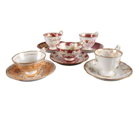 A GROUP OF FIVE H & R DANIEL ACANTHUS SHAPE CUPS AND SAUCERS including three coffee cups, in pattern 6898, pattern 6779 and p