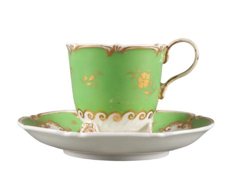 AN H & R DANIEL C-SCROLL CUP AND SAUCER pattern number 4379, with scalloped green ground and central floral sprays, the cup o