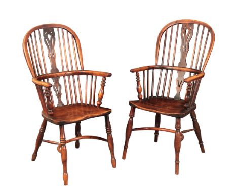 A MATCHED PAIR OF YEW, ASH AND ELM WINDSOR ARMCHAIRSlate 18th/early 19th century, both with low hoop backs with shaped and pi