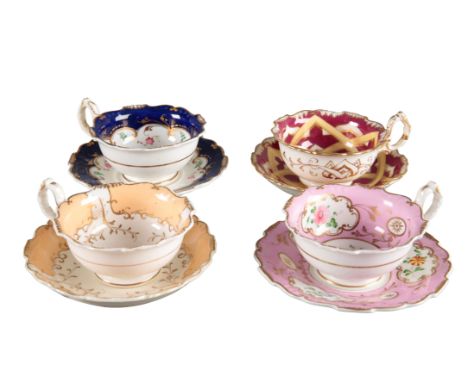 A GROUP OF FOUR H & R DANIEL SHREWSBURY SHAPE TEACUPS AND SAUCERS including pattern 4731, with blue and gilt borders, pattern