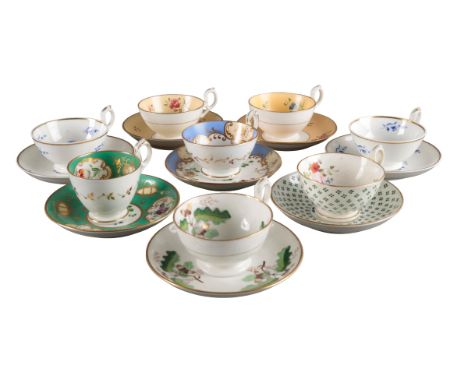 A GROUP OF SEVEN H & R DANIEL PLAIN EDGE SHAPE CUPS AND SAUCERS including teacups in pattern 4689, pattern 4643, pattern 4776