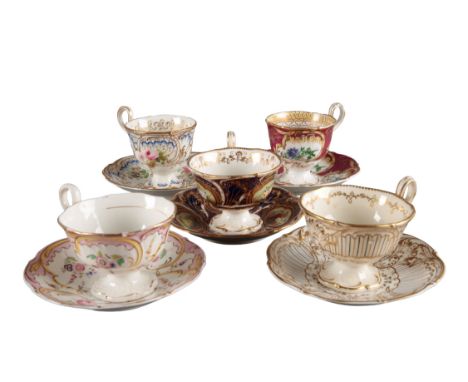 A GROUP OF FIVE H & R DANIEL SAVOY SHAPE CUPS AND SAUCERS including three teacups, in pattern 8842, pattern 8835 and pattern 