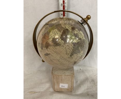 A SMALL GLOBE ON A WOODEN BASE APPROXIMATELY 9.5 INCHES HIGH 