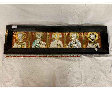 A FRAMED FOUR CERAMIC TILE PICTURE DEPICTING RELIGIOUS SCENES 