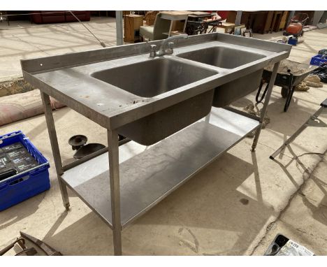 A STAINLESS STEEL DOUBLE SINK UNIT WITH MIXER TAP AND A LOWER SHELF 