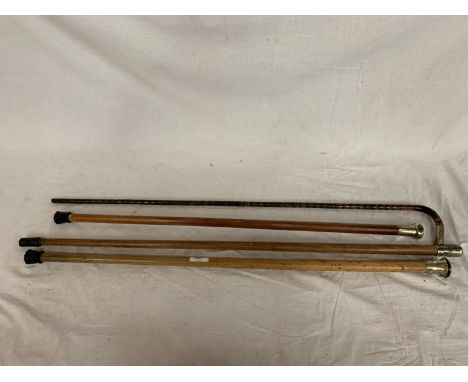 THREE ORNATE WALKING CANES AND A WALKING STICK 