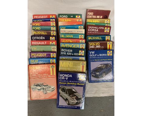 A LARGE COLLECTION OF  30 HAYNES CAR MANUALS TO INCLUDE ROVER, PEUGEOT, VAUXHALL ETC 