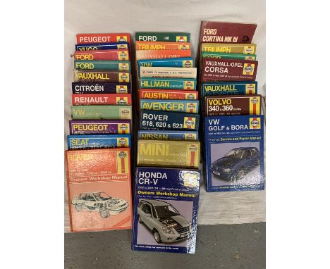 A LARGE COLLECTION OF  30 HAYNES CAR MANUALS TO INCLUDE ROVER, PEUGEOT, VAUXHALL ETC 