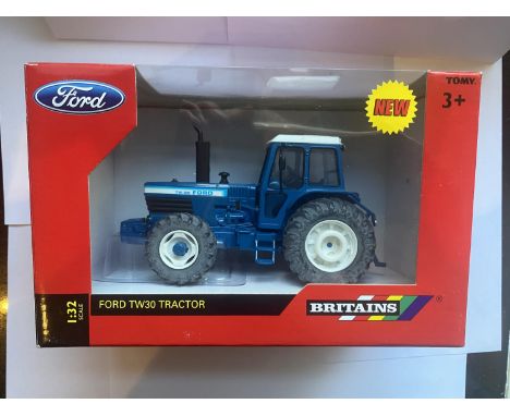 A BRITAINS FORD TW30 TRACTOR 1:32 SCALE NUMBER 42841 - IN MINT CONDITION AND BOXED 