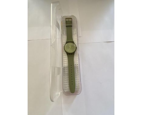 A NEW AND BOXED GENTLEMAN'S SWATCH WATCH 