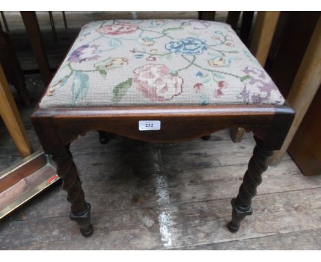 Early 20th century oak framed twist stemmed stool, the loose padded seat upholstered in needlepoint cloth