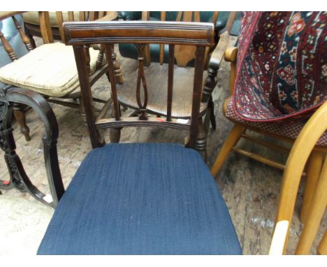 Sheraton style dining chair with 2 straight and 1 shaped vertical stick to back, the padded seat upholstered in dark blue con