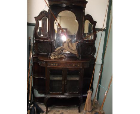 Ornate Edwardian mahogany display cabinet, the upper portion inset shaped central and wing bevel edged mirrors, the lower por