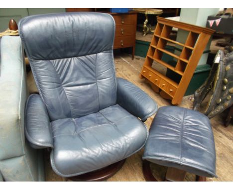 Easy fireside chair and matching stool upholstered in light blue leather