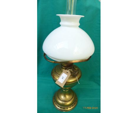 Brass oil lamp with clouded glass shade