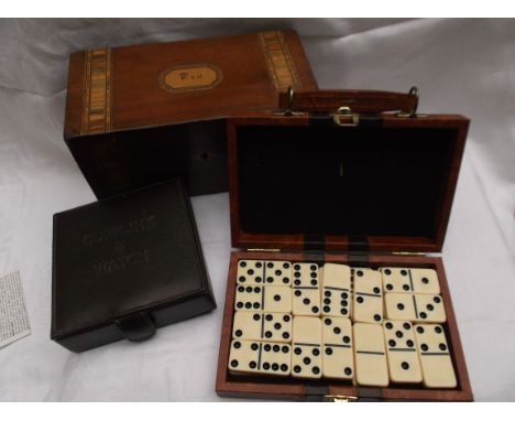 Inlaid tea caddy, box of bone dominoes and a brown leather cufflink and watch box