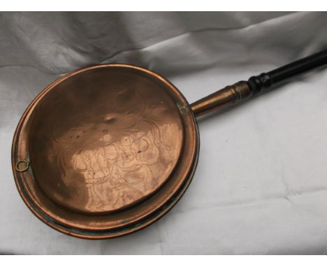 Copper warming pan with long turned handle