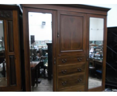 Ornate inlaid Edwardian mahogany double wardrobe unit fitted 2 wing rectangular bevel edged mirrored doors, the central porti