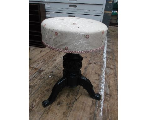 Victorian piano stool on tricorn base, the circular padded seat recently re-upholstered in pink floral contemporary cloth