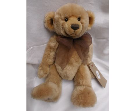Light brown 2009 Charlie Bear with maroon canvas bag