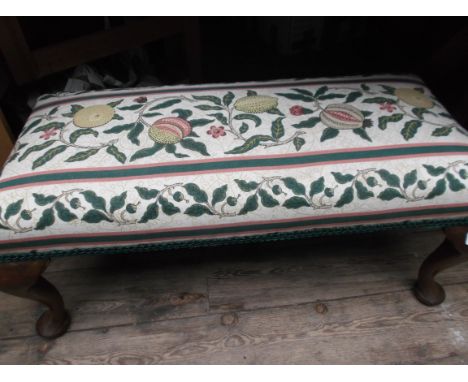 Long rectangular mahogany framed stool, the padded top upholstered in contemporary floral cloth in vivid colours