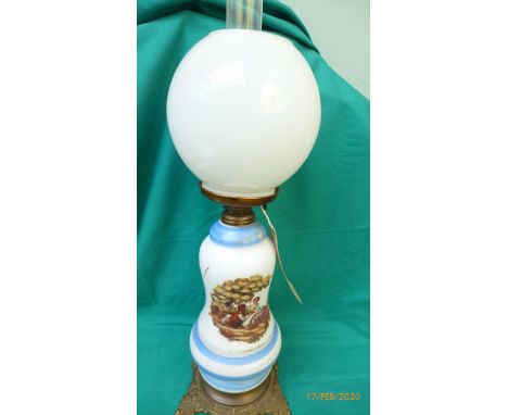Oil lamp with domed clouded glass shade, the white and light blue striped centre decorated a pair of lovers on splayed brass 