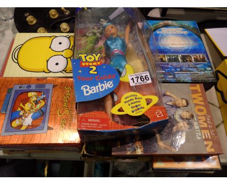 Selection of DVD's and box sets to include The Simpsons and a Toy Story 2 Tour Guide Barbie in box. 