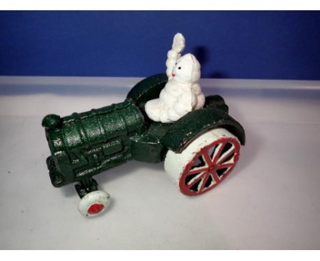 Cast iron Michelin Man in a car. UK P&amp;P Group 1 (£16+VAT for the first lot and £2+VAT for subsequent lots) 