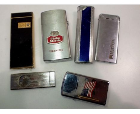 Five mixed lighters and a cigar clipper. UK P&amp;P Group 1 (£16+VAT for the first lot and £2+VAT for subsequent lots) 