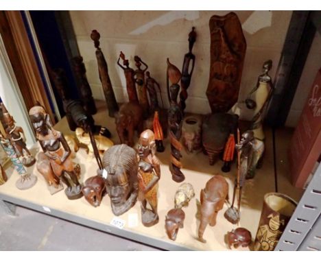 Shelf of African and Indian sculptures/figurines. Not available for in-house P&amp;P 