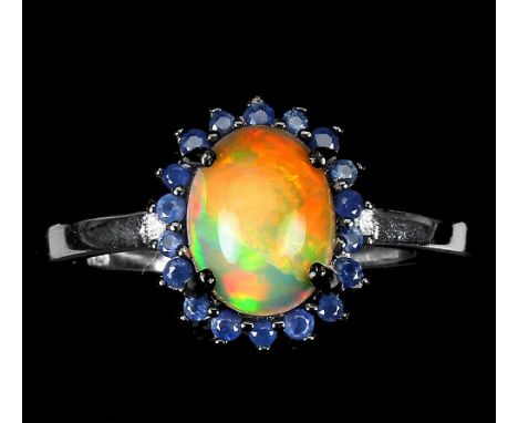 A 925 silver cluster ring set with cabochon cut opal and sapphires, (S).