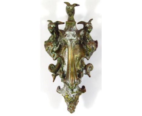 A mid-19thC cast metal Cerberus door knocker, of shaped outline with articulated tear drop centre with metal fastening verso,