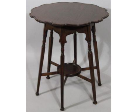 A 19thC mahogany occasional spider leg table, with piecrust top in the Chippendale style, on cylindrical ring topped supports