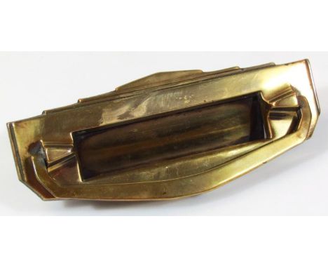 A mid 20thC Art Deco brass letter box, of shaped rectangular outline with articulated slot and brass knocker, numbered A1504,