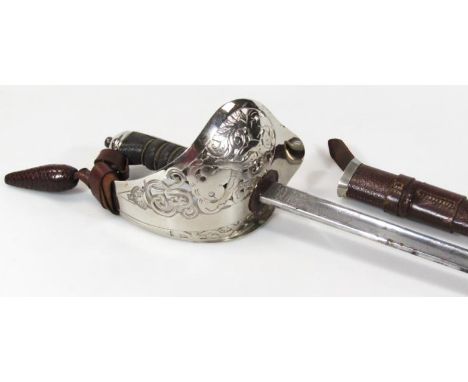 A George V cavalry officer's sword, with part etched Wilkinson silvered blade, leather scabbard and highly elaborate pierced 