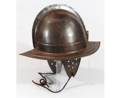 A Cromwellian style tin soldier's helmet, of shaped outline, 20thC construction, 26cm high.