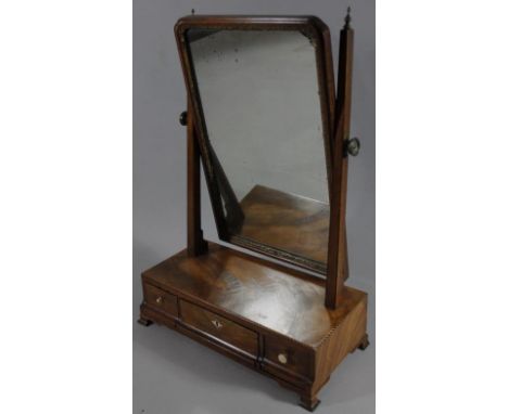 A 19thC mahogany framed table mirror, with a shaped glass, set with moulded plaster surround, flanked by square tapering supp