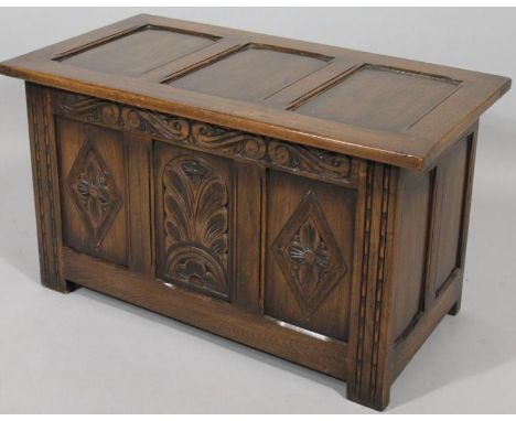 A Jacobean style three panel coffer, of small proportion, the rectangular over hanging top, hinging to reveal a plain interio
