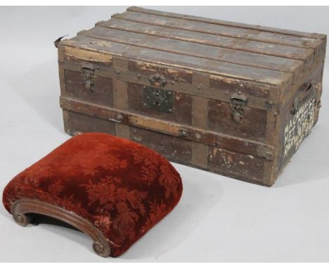 A Victorian mahogany framed hassock, with overstuffed top in (later) floral material, on a scroll base, 17cm high, 40cm wide,