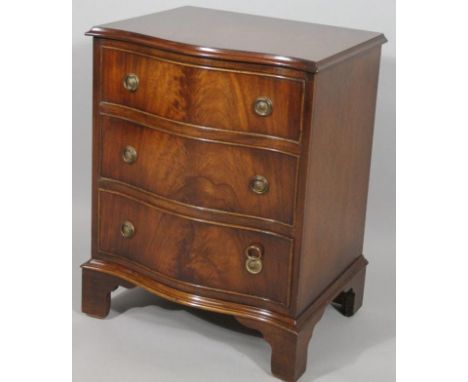 A 20thC mahogany finish serpentine chest, of three long cockbeaded drawers on bracket feet, 68cm high, 57cm wide, 43cm deep.