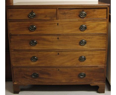 An early 19thC mahogany chest, of two short and four long graduated drawers, with plate back handles raised on bracket feet, 