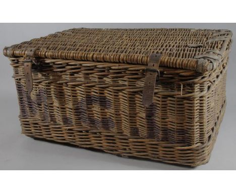 An early 20thC wicker picnic hamper, of rectangular outline with rounded corners and leather strapping, initialled to the fro