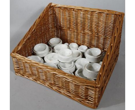 Various paste pot jar bases, probably third quarter of 19thC and later, contained in a wicker hamper, 47cm wide, (a quantity)