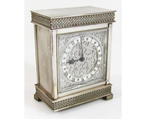 A 20thC Luxor mantel clock, in decorative metal case, with 6.5cm dia. chapter ring with Roman numerals broken by fleur-de-lys