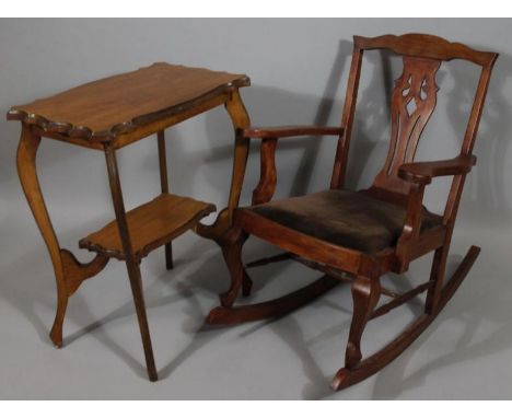 An early 20thC stained mahogany finish Chippendale design rocking chair, probably in beech, 93cm high, and a walnut piecrust 