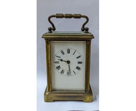 An early 20th century brass cased carriage clock having platform escapement and an enamel dial Location: 9.1 