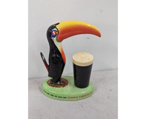 A Carlton ware Guinness Toucan lamp base reading 'How grand to be a Toucan Just think what Toucan do', 'If he can say as you 