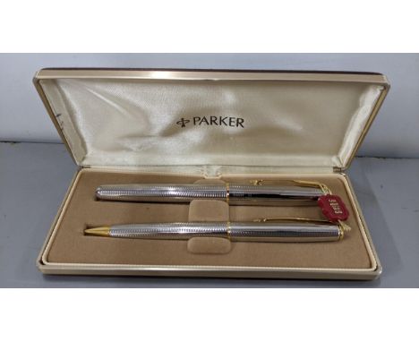 A Parker Sonnet Silver & Gold coloured fountain pen and pencil set, boxed, with 18k nib Location: CAB9 