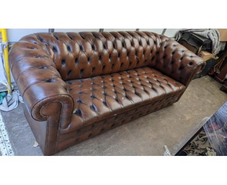 A brown leather button back chesterfield sofa 74hx212wLocation:CONR 