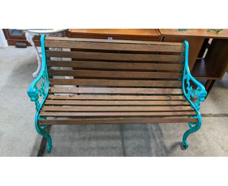A modern green painted, cast and metal, slatted garden bench, 79.cm h x 126cmLocation:G 